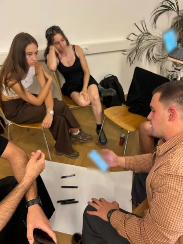 A group discussing a sustainability challenge during the mini hackathon