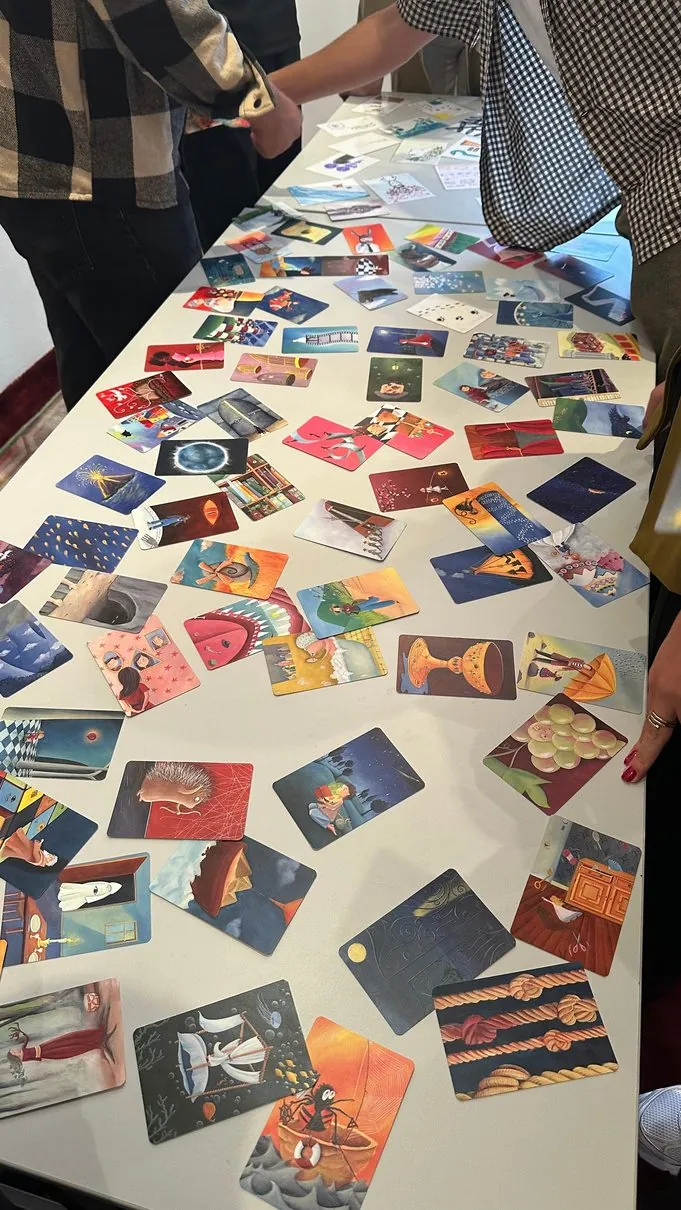 Workshop cards spread out on a table