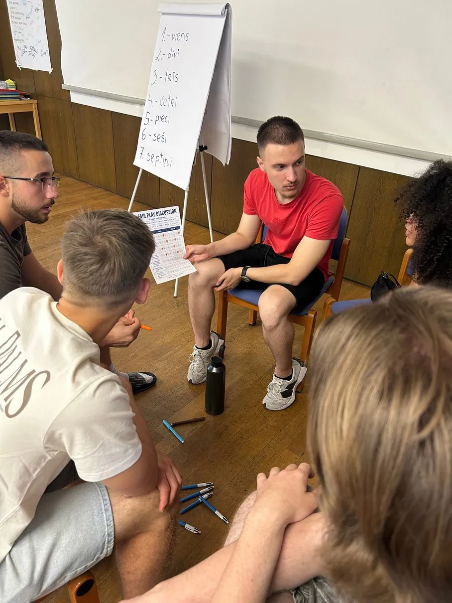 Students presenting at a flipchart