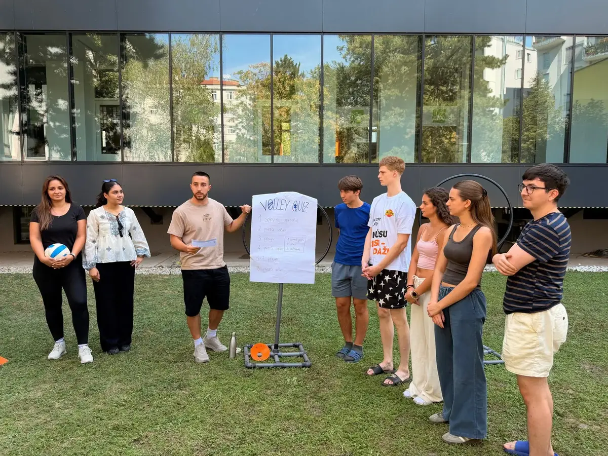 A team challenge outdoors with a flipchart