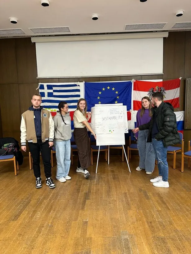 Youth exchange participants with their national flags